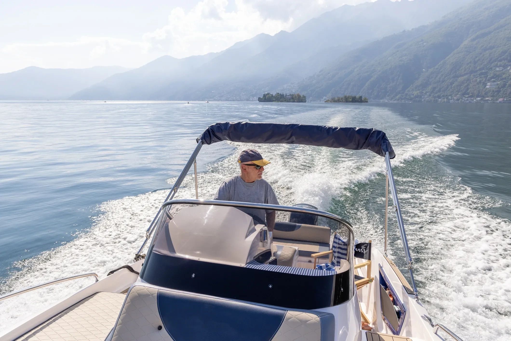 Boat captain navigating on Lake George in the Adirondacks